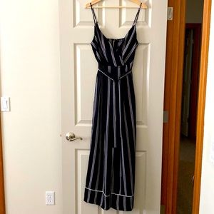 Super cute jumpsuit in black and white. Size M